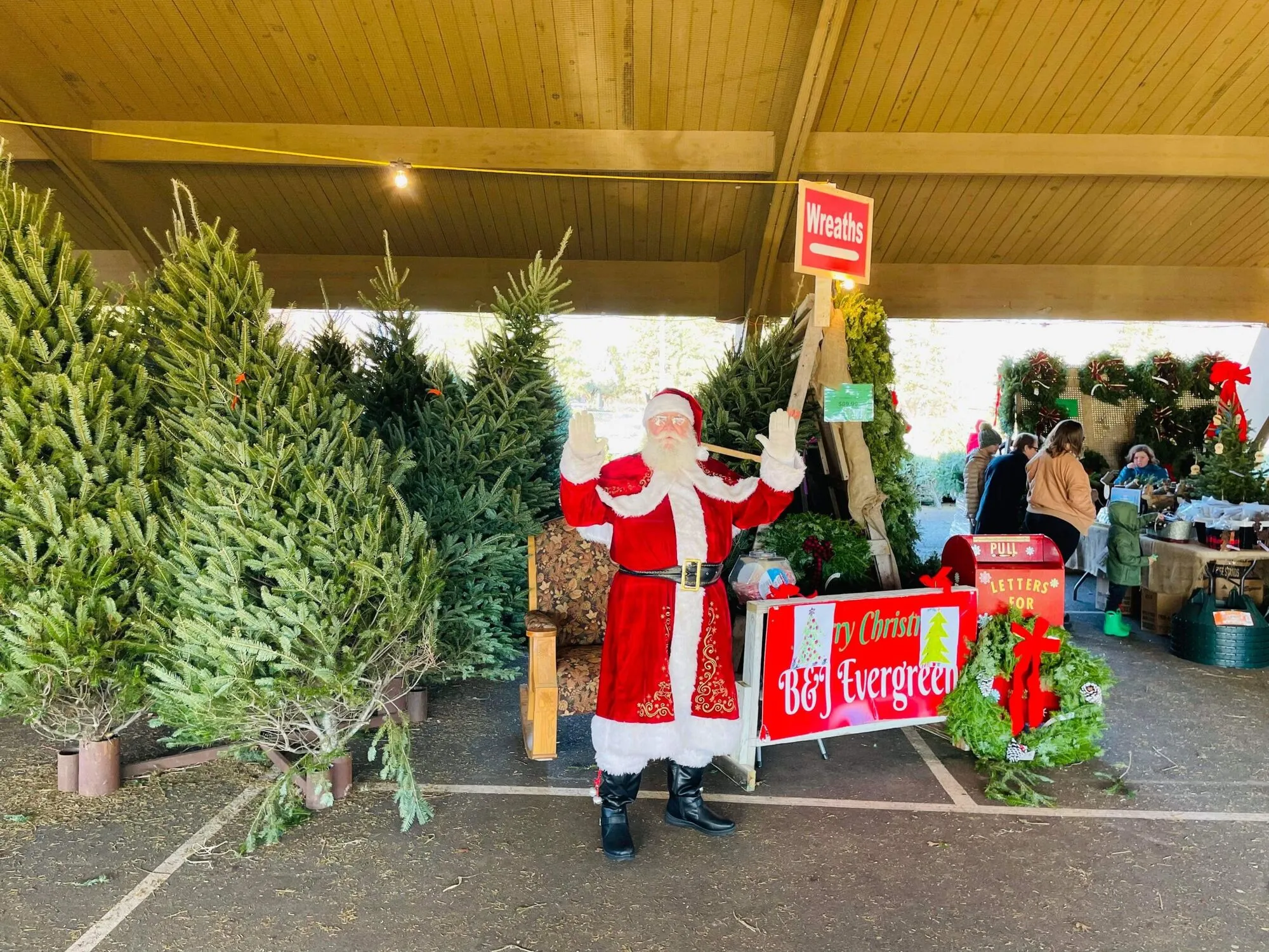 Santa visiting families at a B&J Trees Christmas tree lot